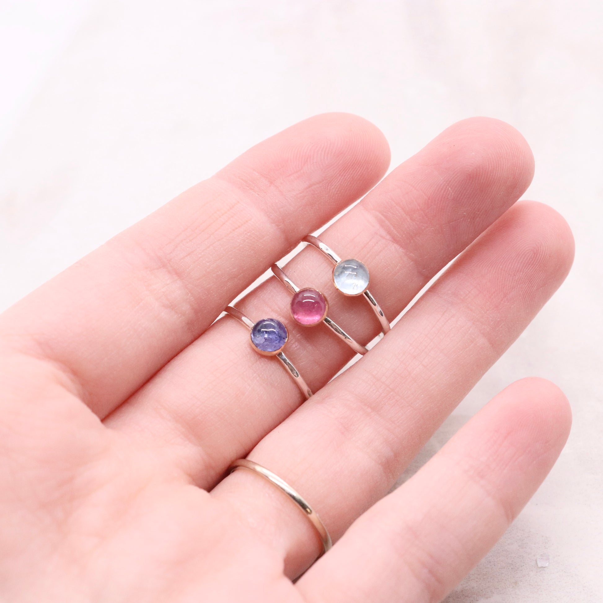 Pink tourmaline, tanzanite, and aquamarine boho mixed metal gemstone ringsPink tourmaline, tanzanite, and aquamarine boho mixed metal gemstone rings