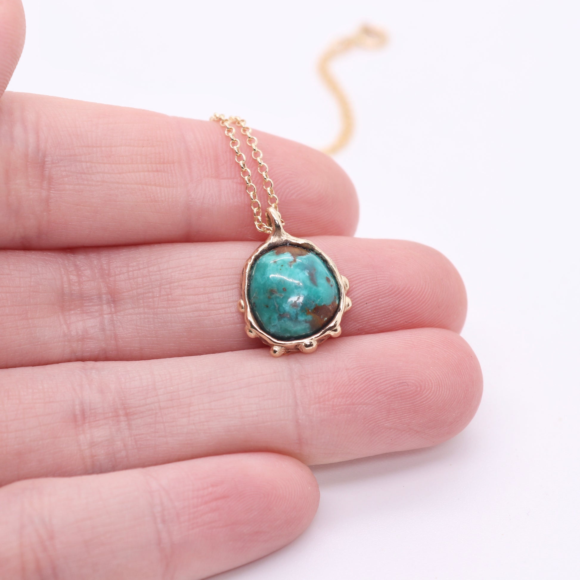 Sierra Nevada turquoise necklace set in solid 14k gold with an organic sculptural bohemian look