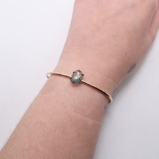 Green tourmaline gemstone set in a 14k gold filled cuff bracelet