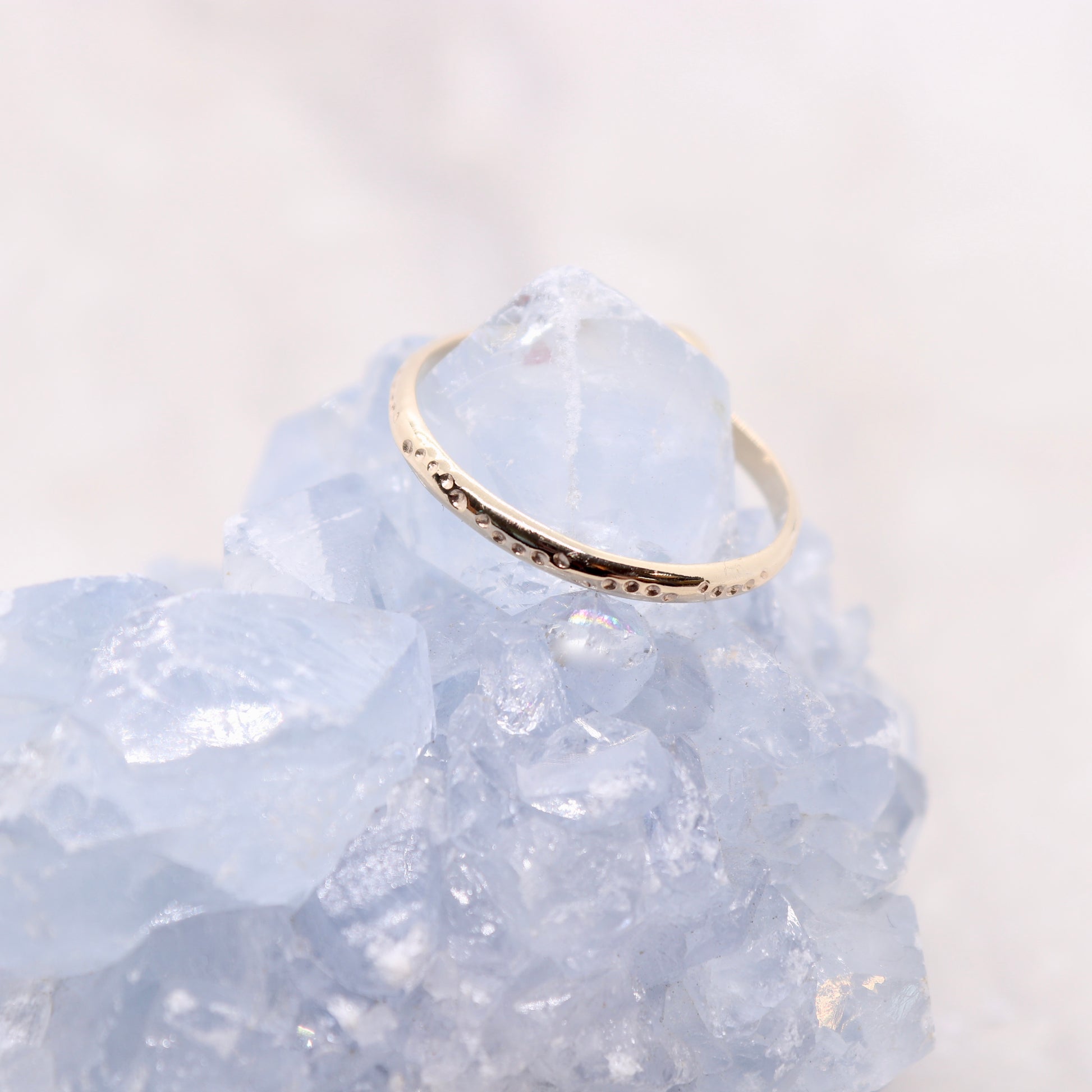 Pink tourmaline gemstone on a solid 14k gold ring band, a unique alternative engagement ring