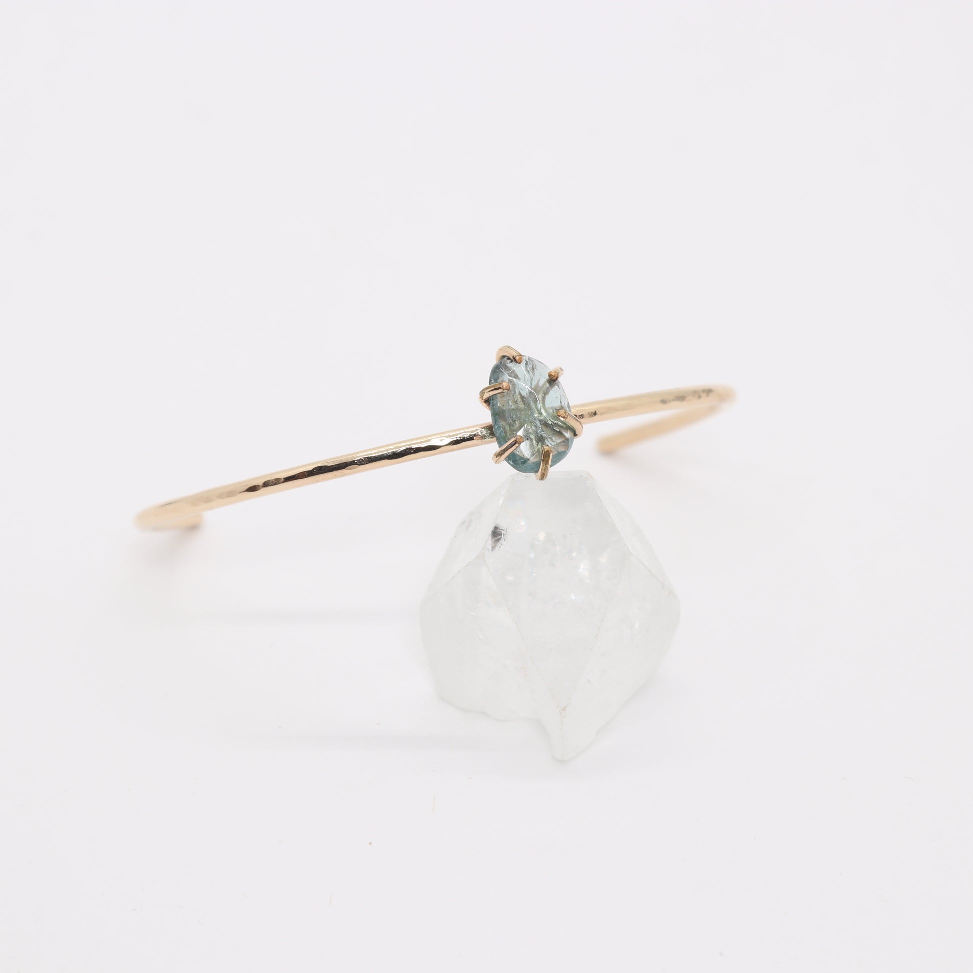 Green tourmaline gemstone set in a 14k gold filled cuff bracelet